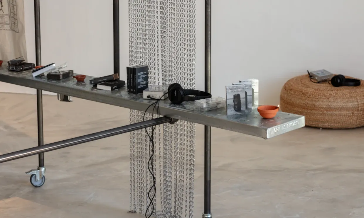 Close up shot of cassettes and headphones on a shelf.