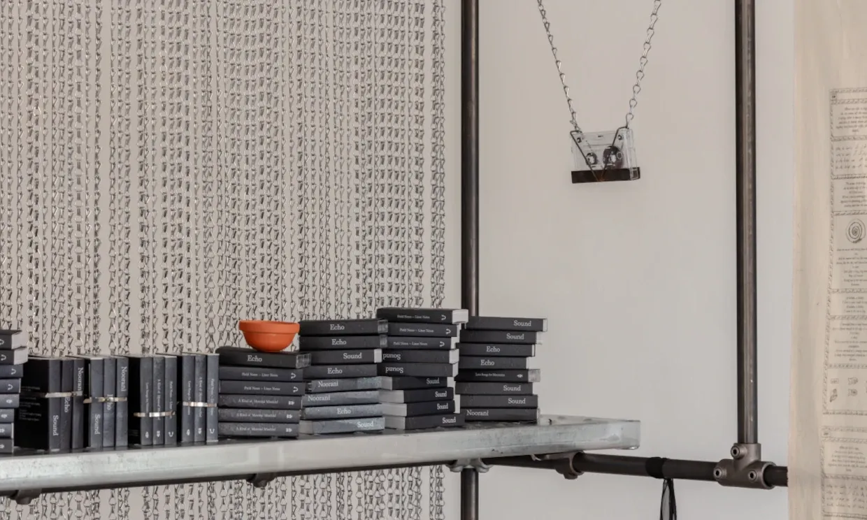 A close up shot of many cassettes displayed on a shelf.