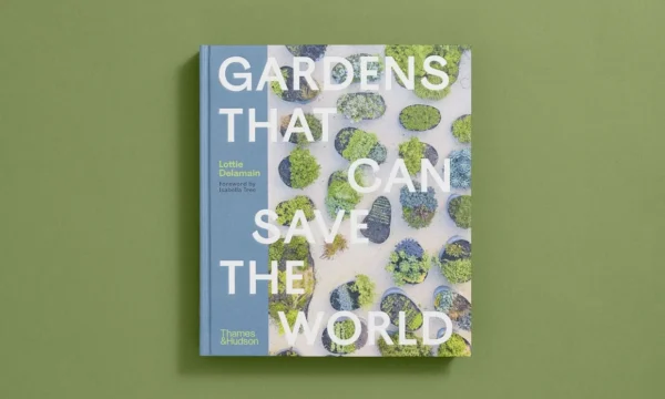 Photograph of front cover of Gardens that can Save the World. Little tiny plant beds feature behind the large title text