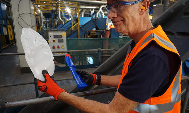 Biffa Steve Olds shows two types of plastic to be separated 620