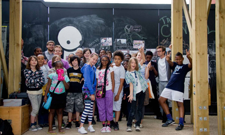 Pirate material: Hackney Pirates participants next to a Stik mural