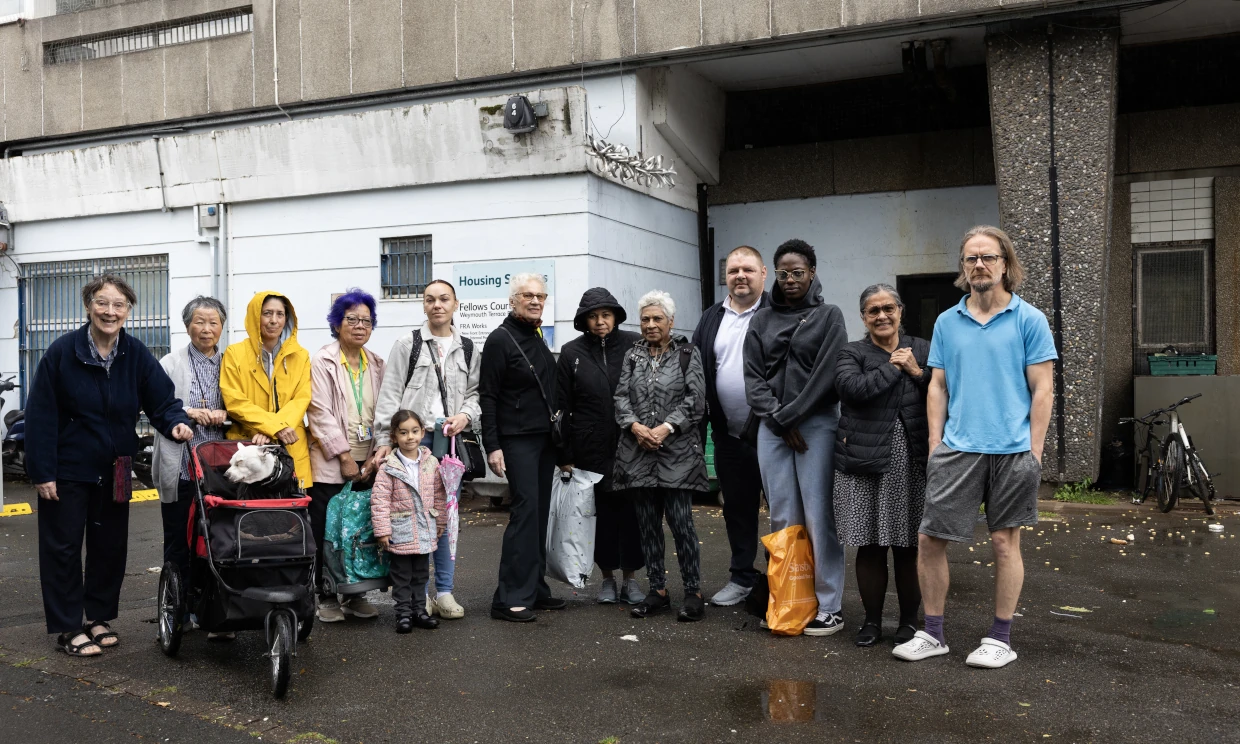 A group of residents stand outside Fellows Court.