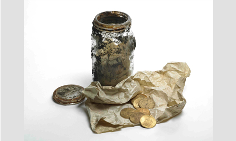 Gold coins and glass jar