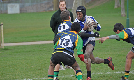 Man of the match Colin Kpodonu takes on the Kilburn backs