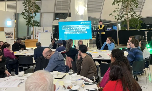 Zoe Garbett addressing a room of people from a lectern.