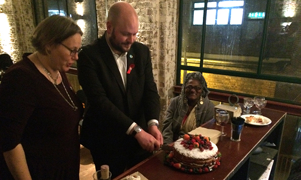 Hackney's mayor Philip Glanville cuts the cake at Immediate Theatre's 20th anniversary party