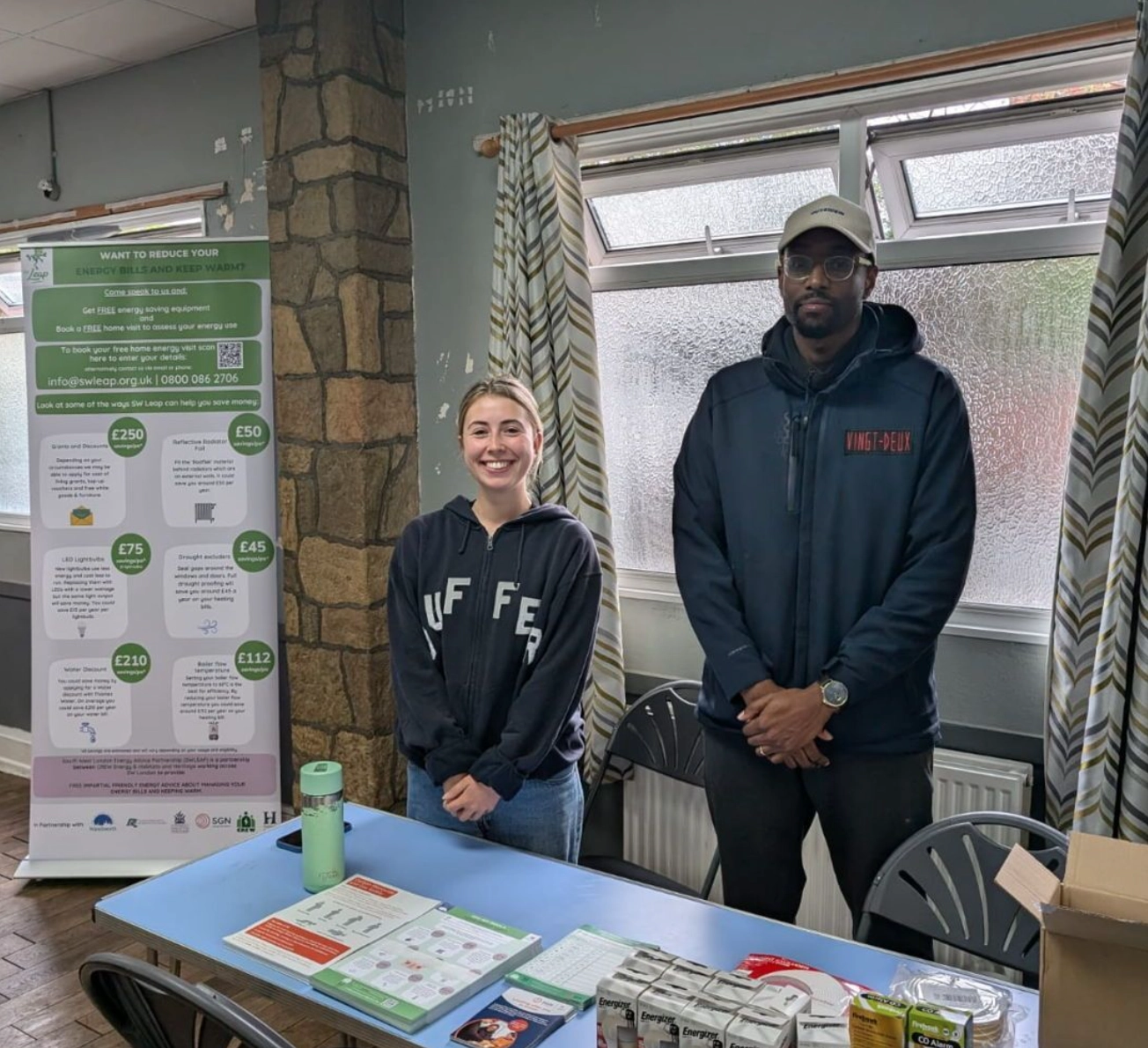 Izzie and Chinazo at a Crew stand