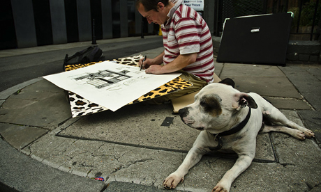 Mr Dolan drawing on a Shoreditch Street with his dog George
