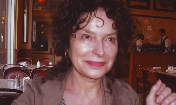 Close up of Julia Pascal smiling in a restaurant