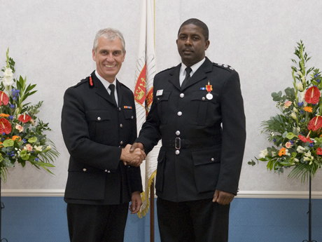Leslie Bowman 001 Hackney firefighter Leslie Bowman receives his award for 20 years' service