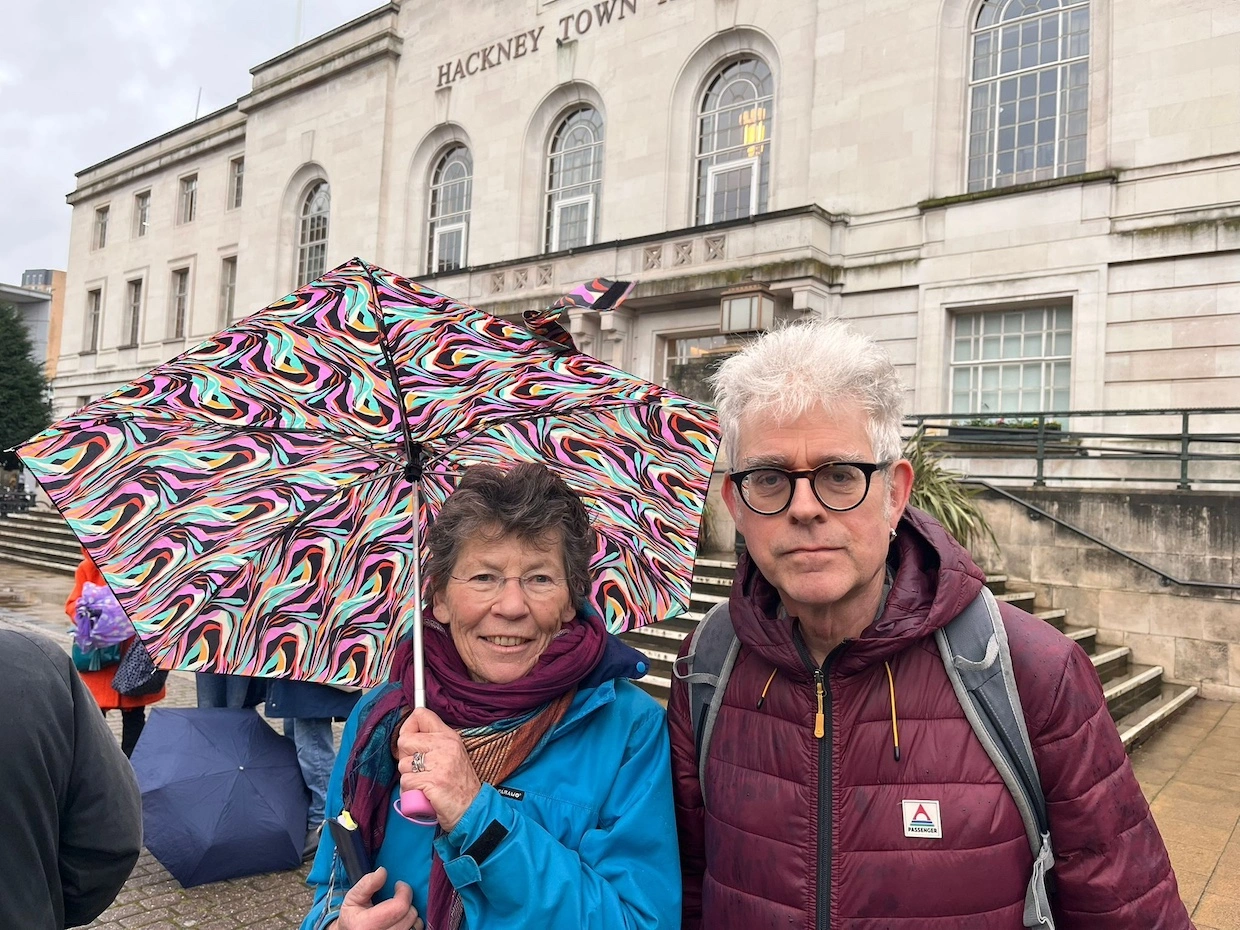 Hackney Coalition Against Palantir's Marion Macalpine and George Binette outside the Town Hall.