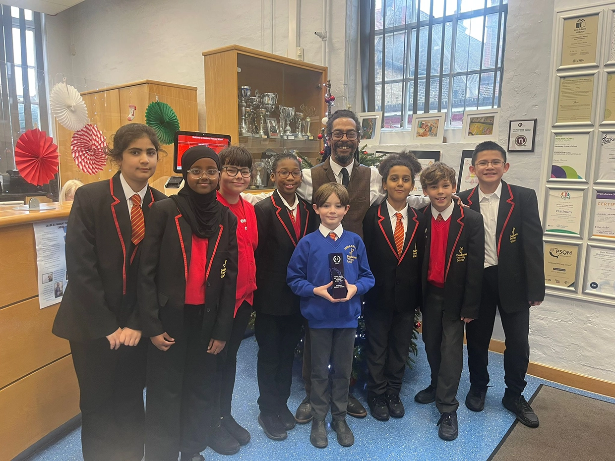 Pupils at Daubeney Primary School and Headteacher Gregory Logan with the FutureEd Trophy