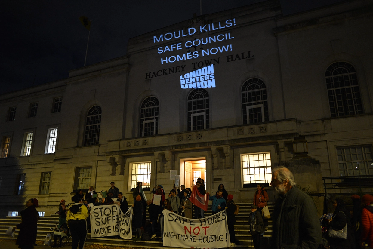 Protestors projected warnings on Hackney Town Hall to mark the start of Awaab's Law