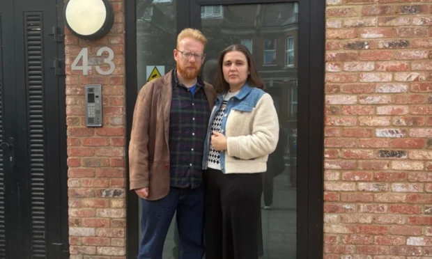 Richard and Anna Bell stand in front of their Hackney home.