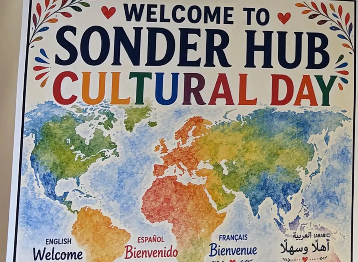 A poster that reads "Welcome to Sonder Hub Cultural Day", featuring a colourful map of the world.