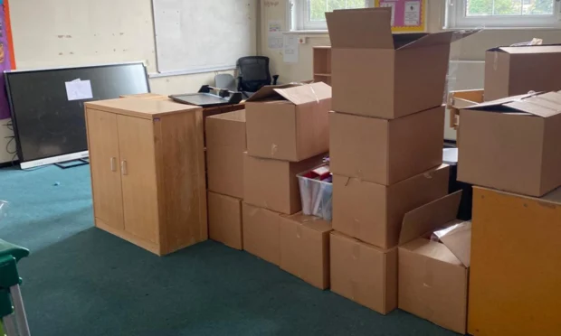 School staff say removals teams told them stacks of boxes were set for landfill.