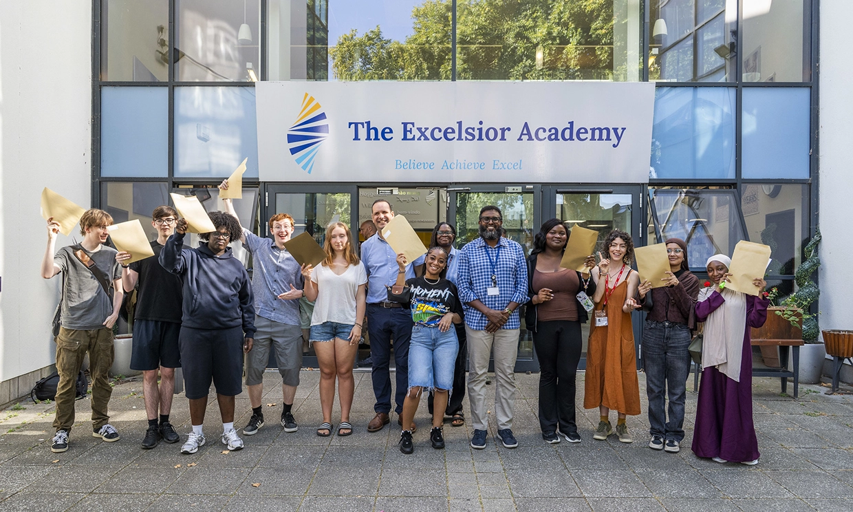 Young people, teachers and Council representatives celebrating their results at The Excelsior Academy in Hackney
