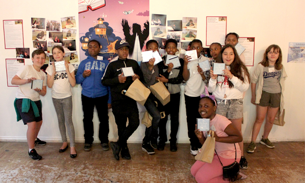 Some of the young authors pose with their freshly minted CDs at the Red Gallery launch event. Photograph: Penguin Random House UK / Ministry of Stories