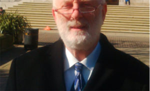 Councillor Ian Sharer, who does carry one of the alarms