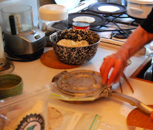 Gillian Riley gets to grips with a Mexican tortilla press. Photograph: Annalies Winny